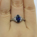 Women's silver geometric hollow ring with zircon stone on alloy band.