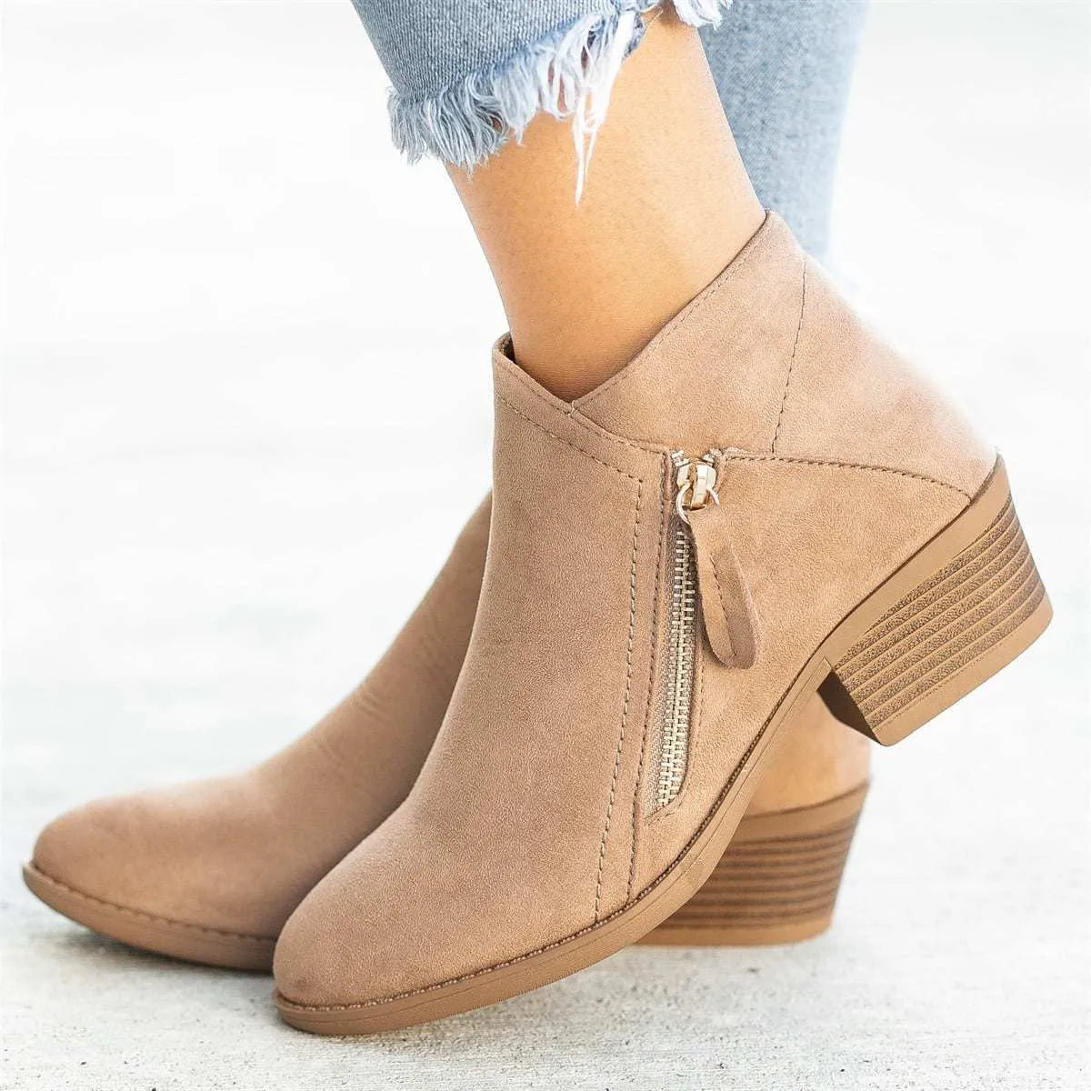 Women's suede Dr Martens-style ankle boots with side zip and chunky heel in blue.