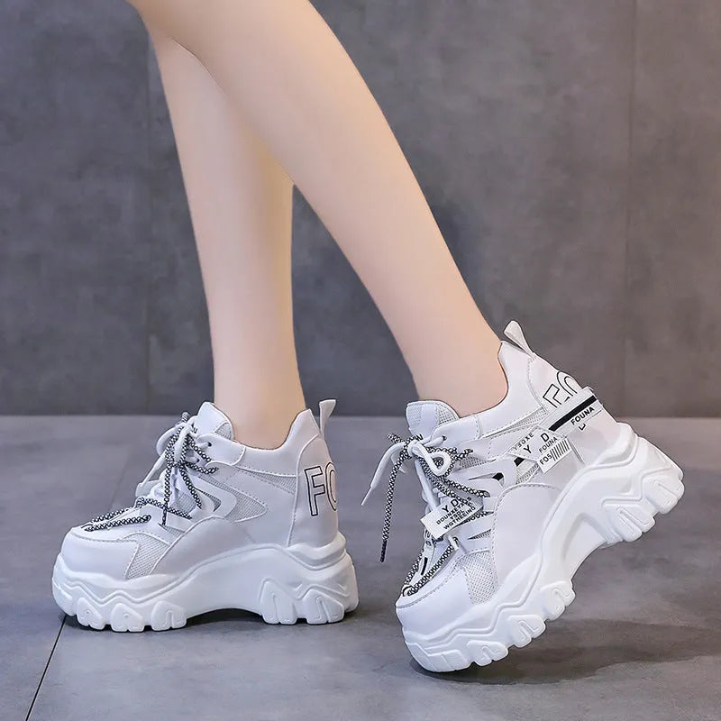 Women's white mesh platform sports shoes with a cross-strap design and rubber sole