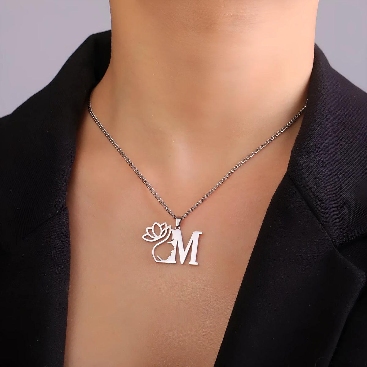 Stainless steel fashion necklace with cross chain design and letter pendant in gold or silver finish