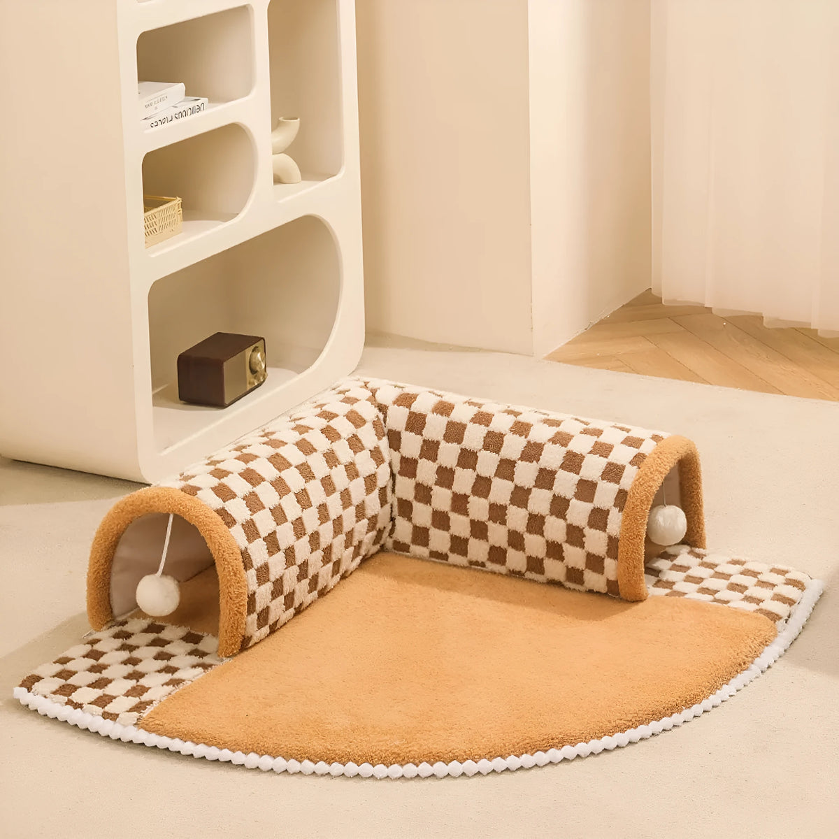 Coffee coloured fan-shaped plush pet bed with a tunnel entrance and anti-slip granular base.