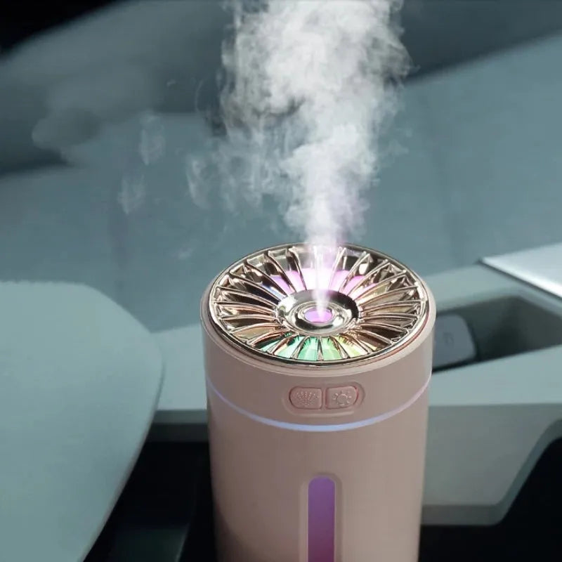 Black wireless USB humidifier with colourful lights on a car dashboard cup holder