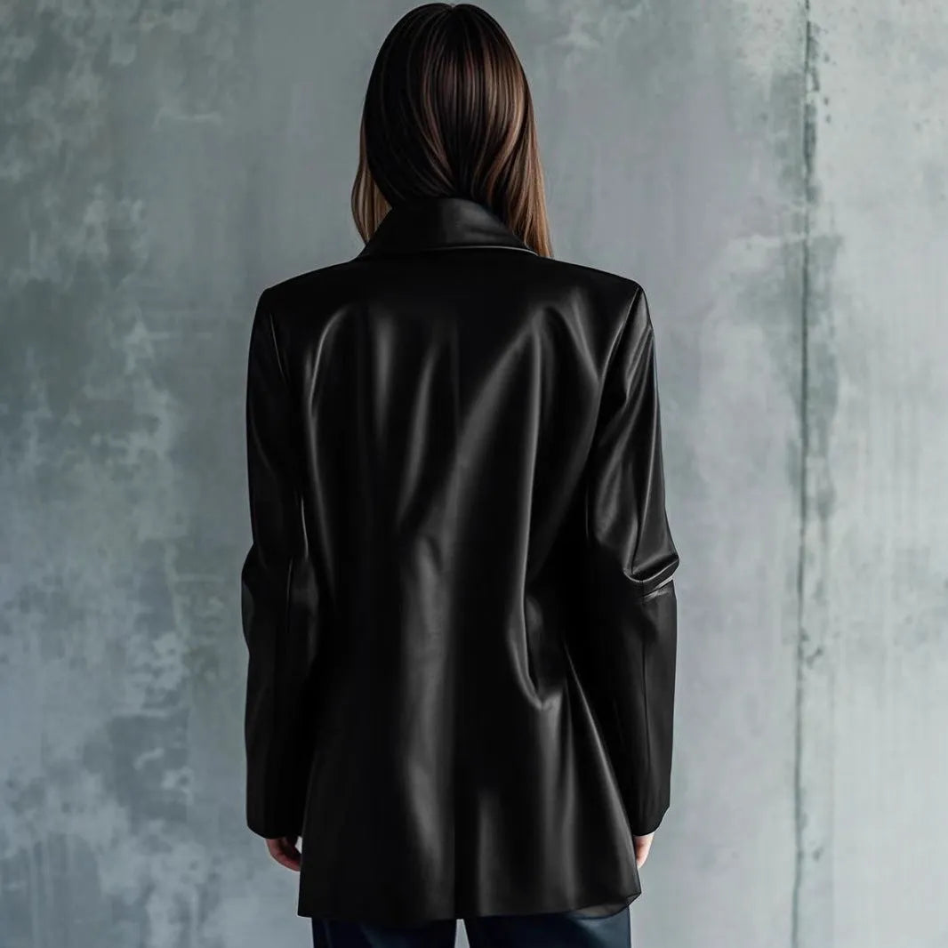 Black women's polyester leather jacket on a hanger, showing medium length and long sleeves.