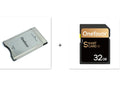 SD to PCMCIA adapter card with stainless steel housing for Mercedes-Benz cars next to a 32GB SDHC card