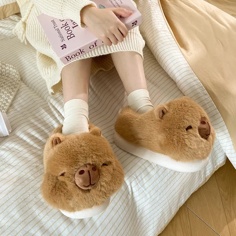 Light brown women's winter slippers with plush upper, artificial wool lining, and slip-on design