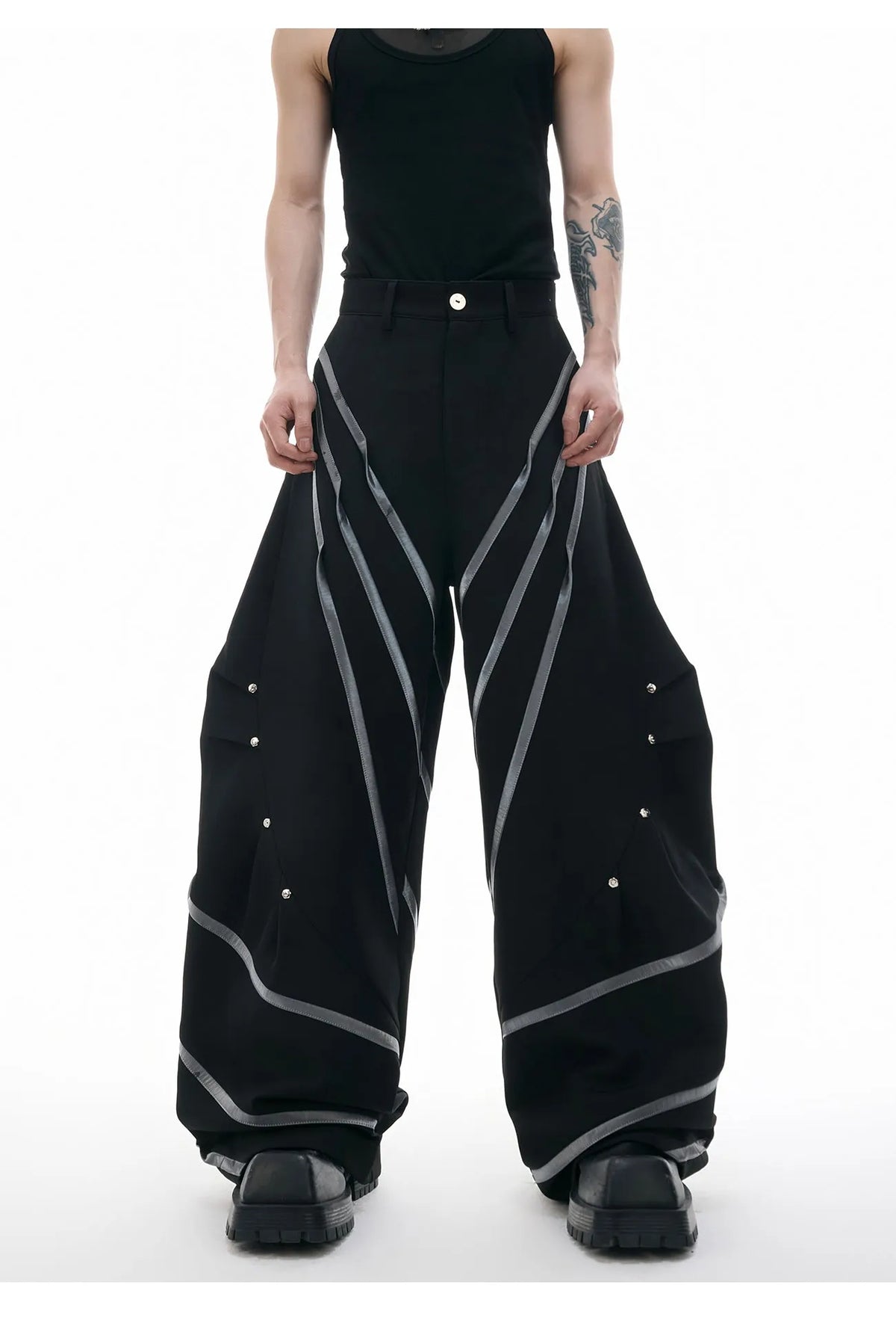 Men's trousers with three-dimensional cutting and metal striped rivet pleated detailing in black or white