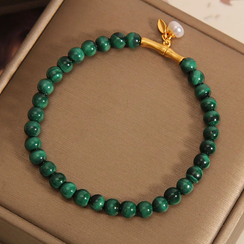 Women's white crystal bamboo bracelet showing adjustable design with bead arrangement
