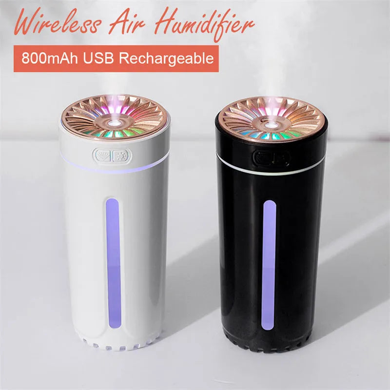 Black wireless USB humidifier with colourful lights on a car dashboard cup holder