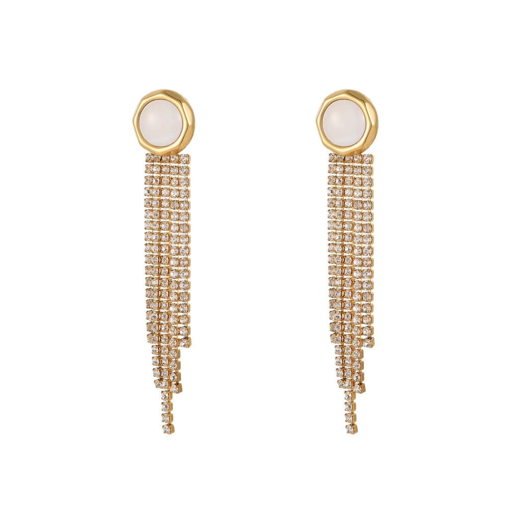 Women's gold heart and star shaped earrings with a diamond tassel detail on a white background.