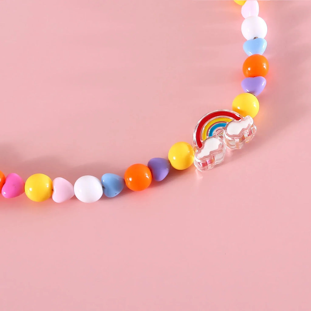 Colourful plastic bead cat necklace shown in peach, rainbow, or small flower pattern options with adjustable sizing
