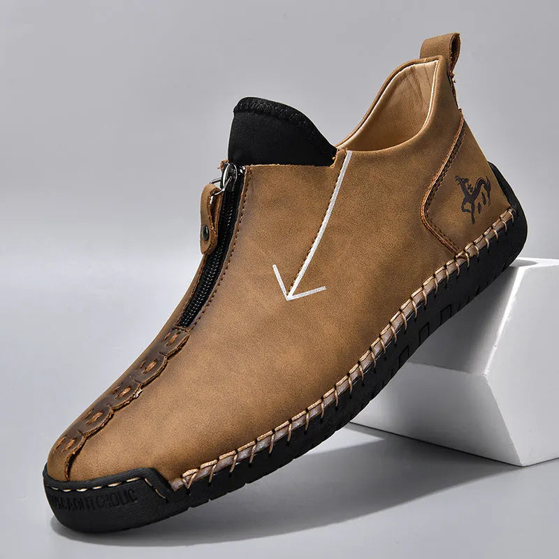 Men's black casual Martin boots with a front zip, round toe, and low rubber sole.