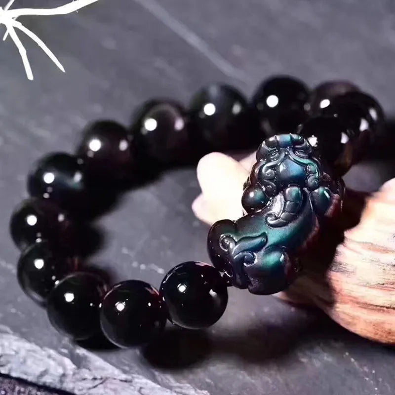 Natural grey obsidian crystal beaded bracelet shown in multiple bead size options on a wrist.