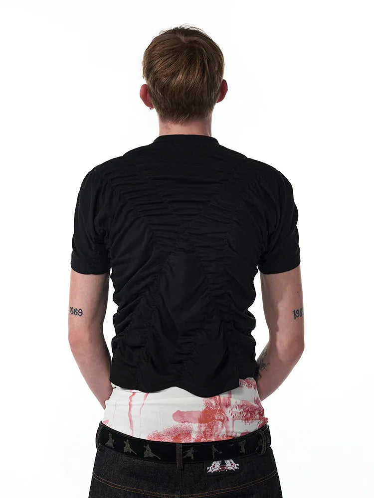 Black slim fit men's short sleeve T-shirt with a printed design, shown on a model.