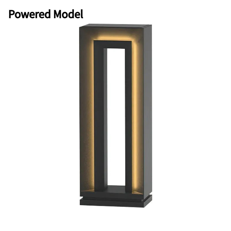 A modern square-shaped stainless steel and acrylic outdoor garden lamp with a geometric design.