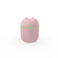 Round desktop humidifier in ivory white with USB cable and single mist outlet