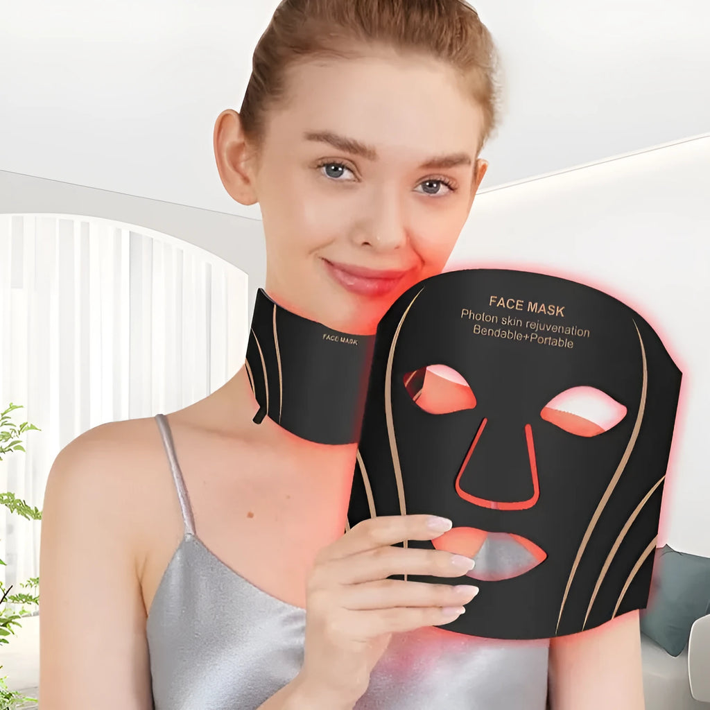 Black gold coloured IPL and LED photon beauty mask device with a headband and touch screen button.
