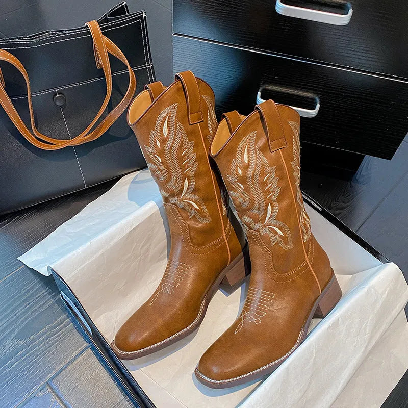 Brown women's mid-calf lace-up Martin boots with embroidered pattern on the upper.