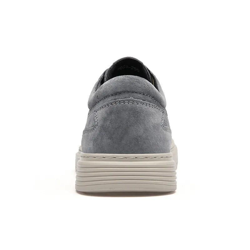 Men's grey pigskin leather casual skate shoes with a flat rubber sole and lace-up front.