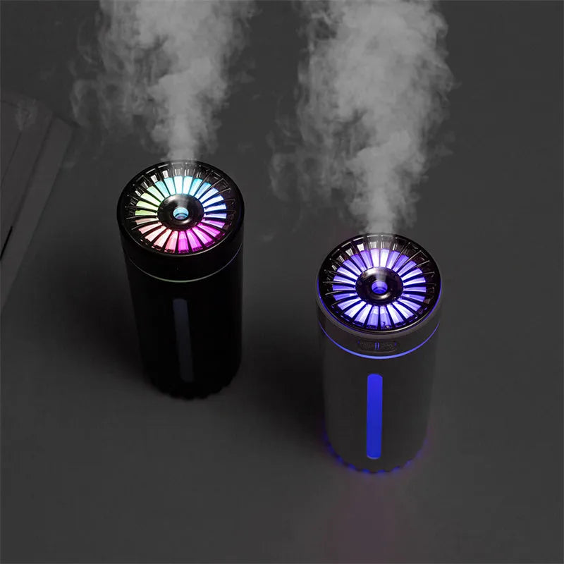 Black wireless USB humidifier with colourful lights on a car dashboard cup holder