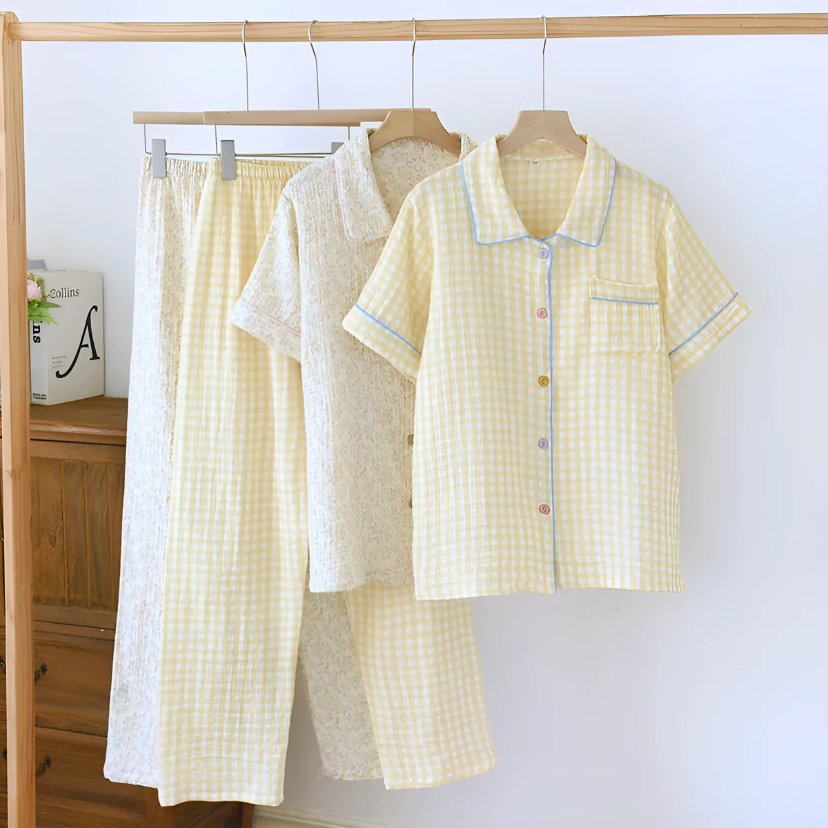 Women's loose blue Flower Sea pattern cotton gauze short-sleeve top and trouser set laid flat.