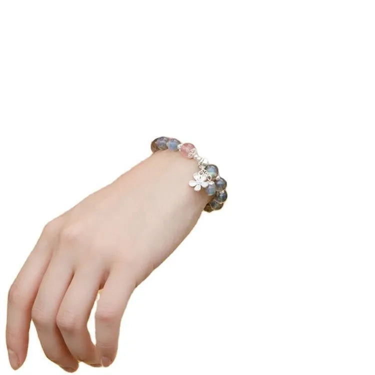 925 sterling silver honeysuckle bracelet with moonlight lime and strawberry crystals on wrist