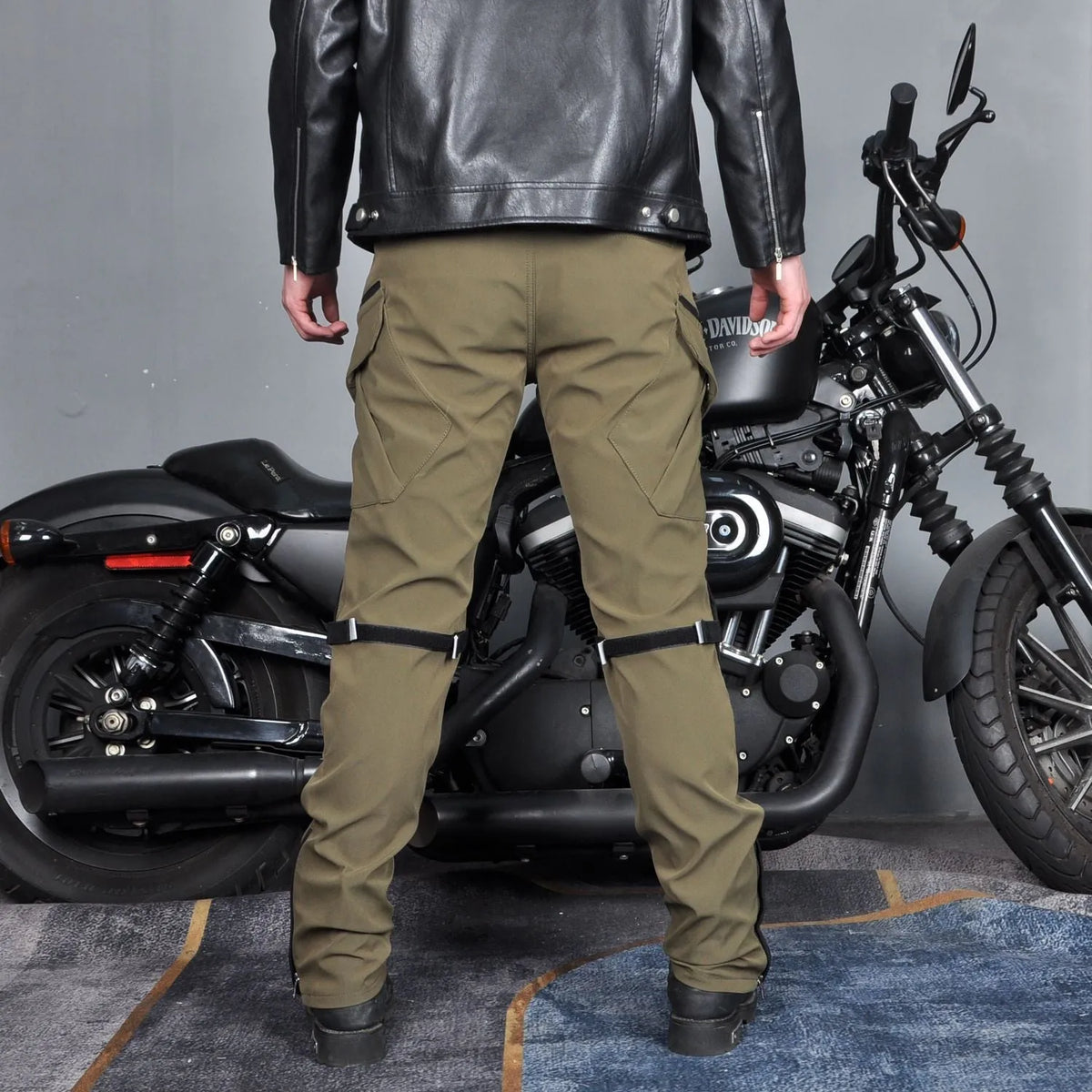 Men's waterproof motorcycle cycling pants with protective gear in black or green colour options