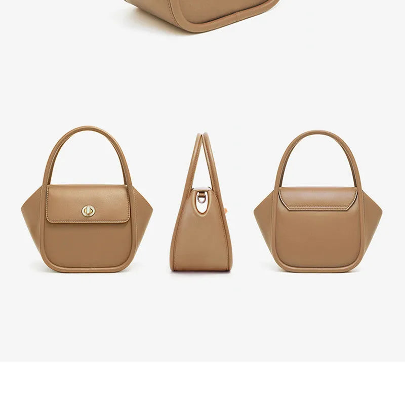 Soft cow leather wing-shaped tote handbag with a buckle latch and single cross-body shoulder strap.
