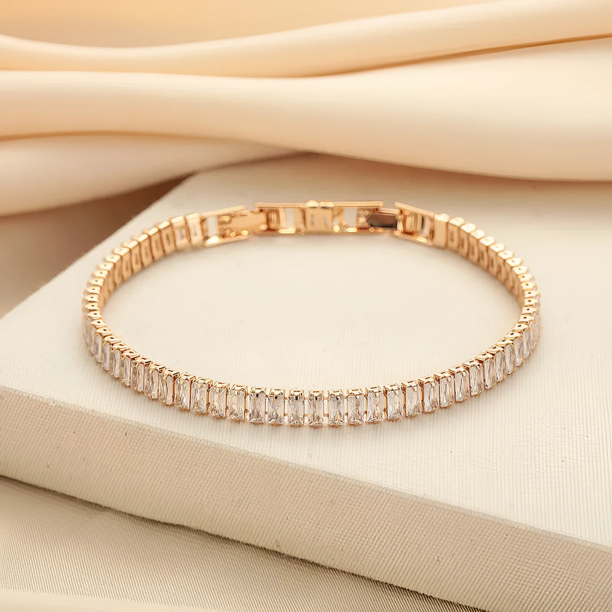 Geometric shape brass bracelet with full diamond zircon inlay in champagne gold colour.