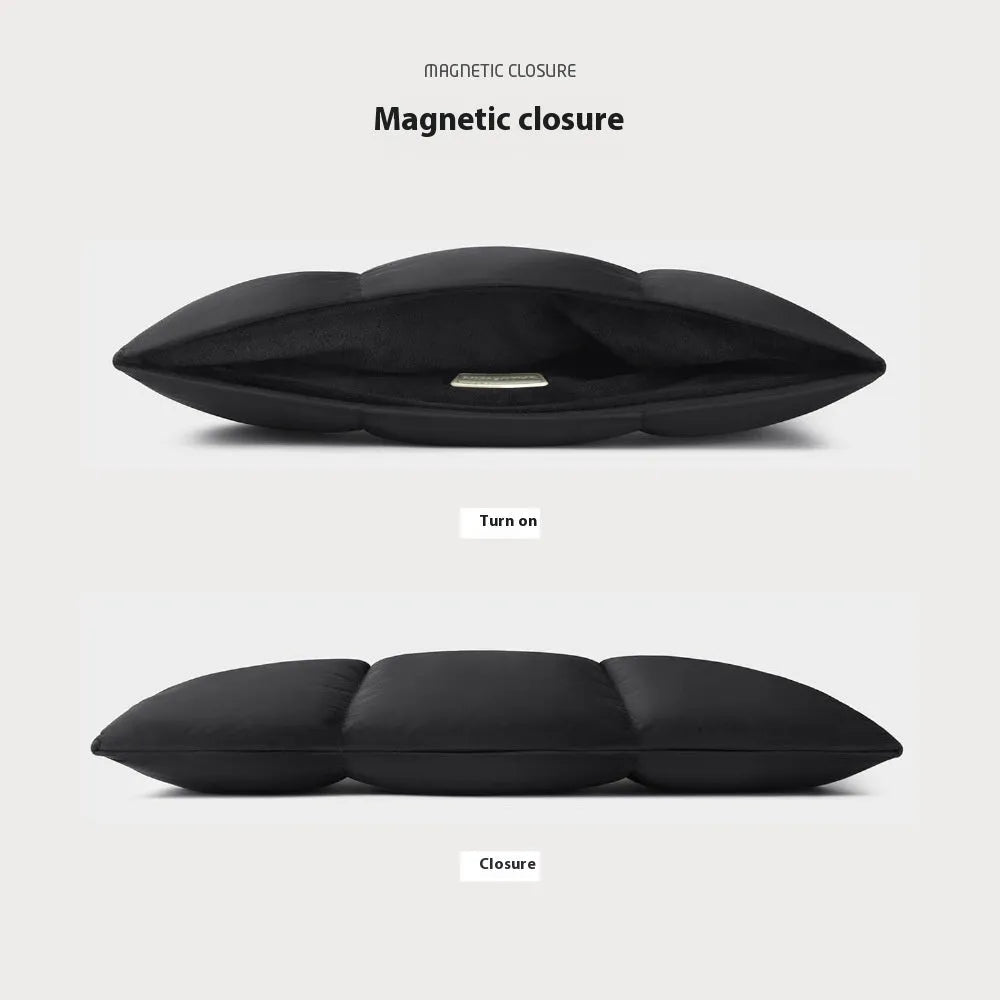 Soft fluffy black laptop sleeve with sewing thread details for 13 to 15.6 inch devices.