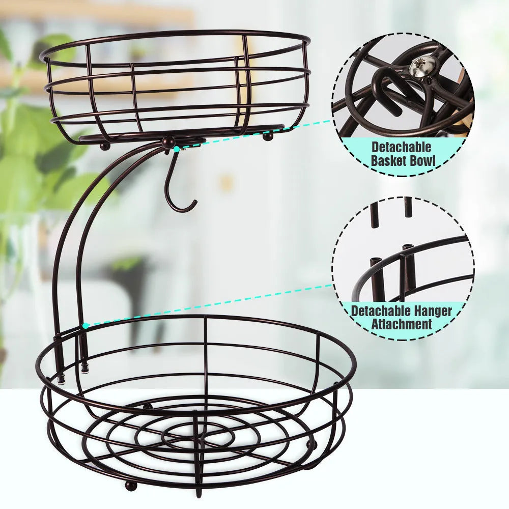 Double-tier black wrought iron fruit basket filled with assorted fruits on a countertop