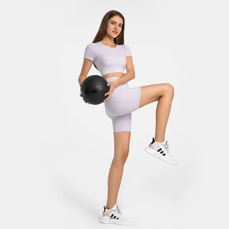Women's tight-fit sports shorts in cotton blend fabric, shown in black, for running and gym workouts.