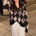A knitted casual cardigan in a macaron colour, shown in a regular fit with regular-length sleeves.
