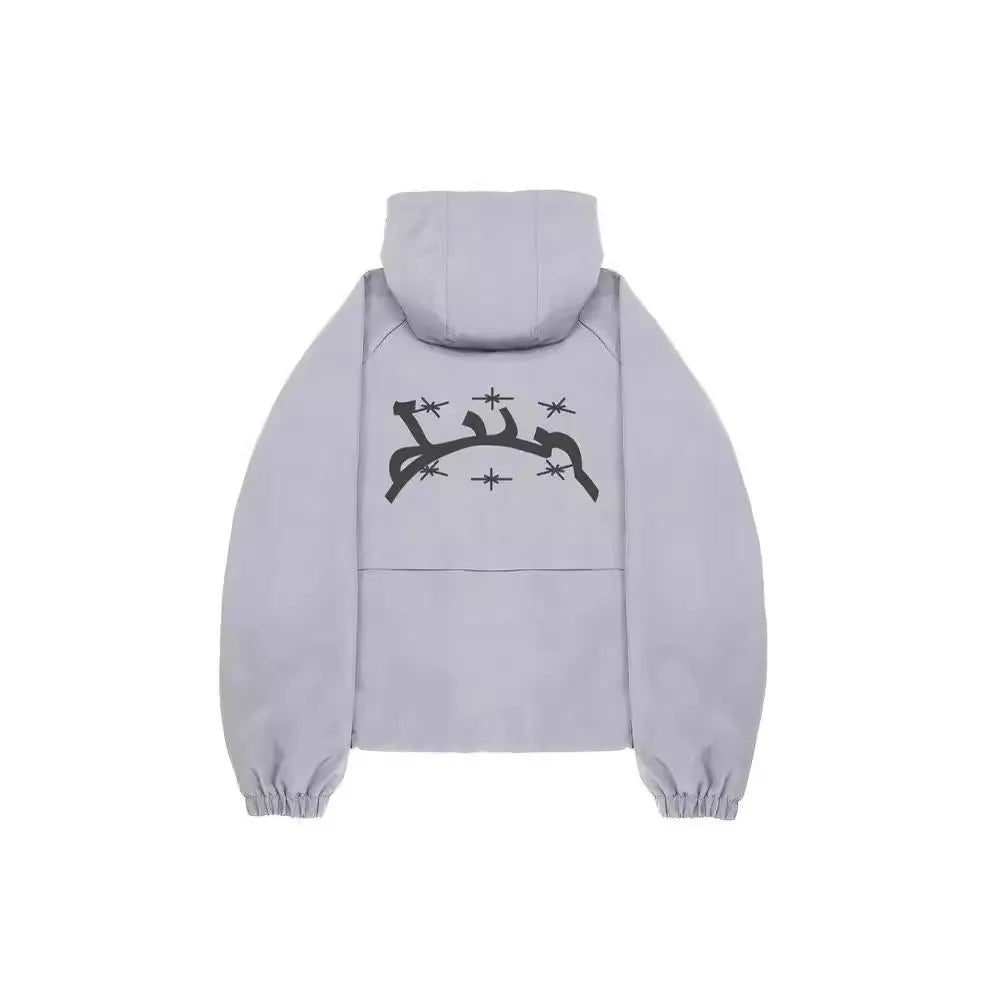 Grey men's hooded loose-fit sunscreen jacket in British style on a hanger