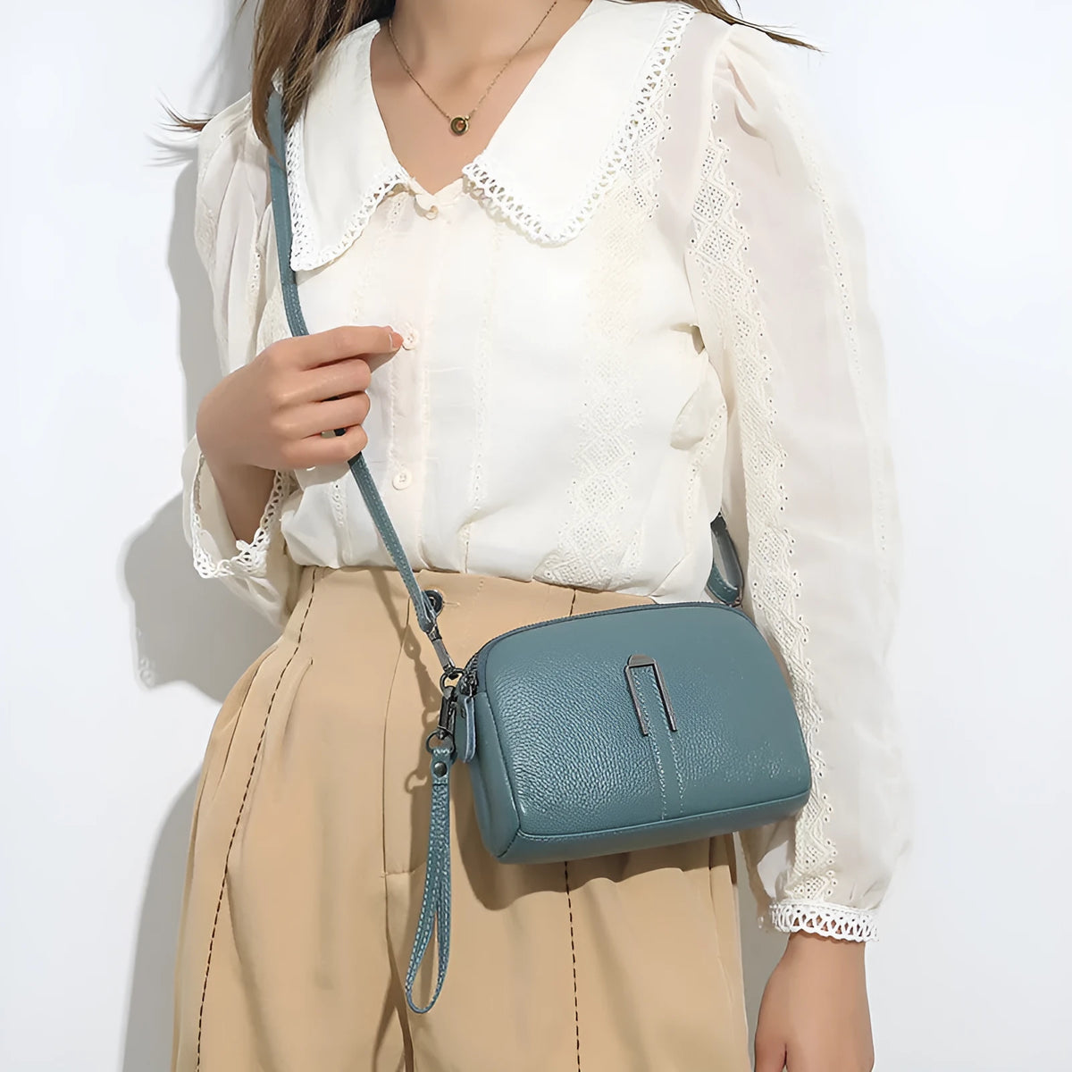 Genuine leather women's shoulder bag in a horizontal square shape, shown in black colour.