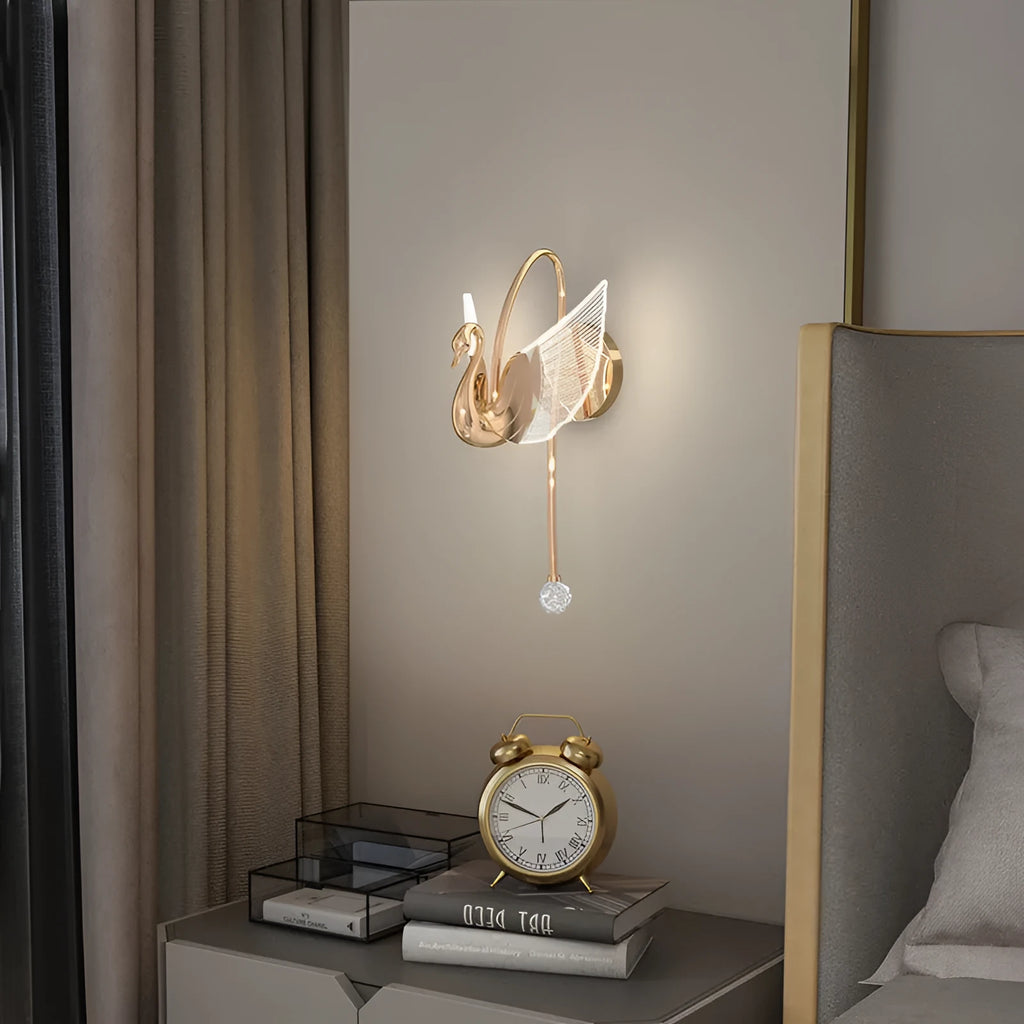 Gold-finish iron swan bedside wall lamp with acrylic shade and dimmable LED light.