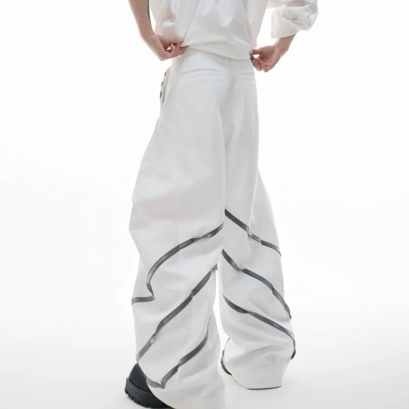 Men's trousers with three-dimensional cutting and metal striped rivet pleated detailing in black or white