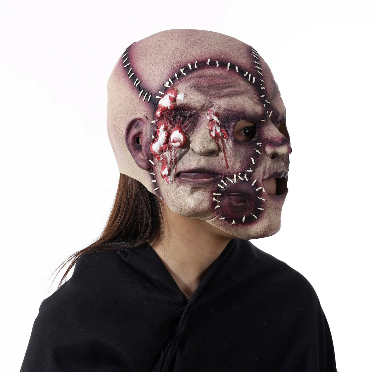 Latex three-sided Grimace horror Halloween mask for adults on a black background.