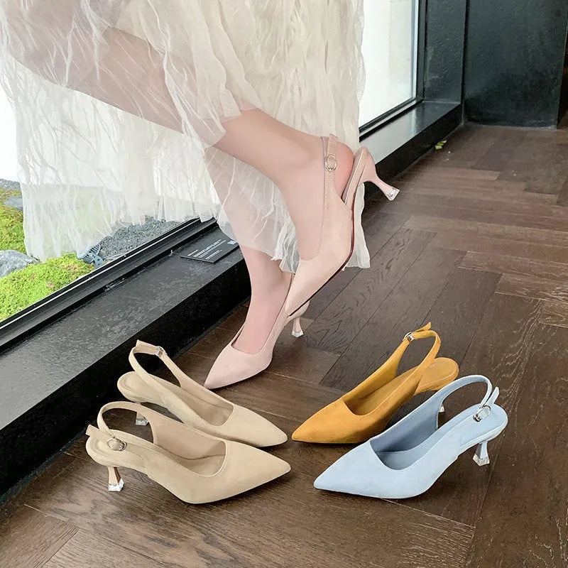 Women's suede stiletto high heels with pointed toe in apricot colour on a light background.