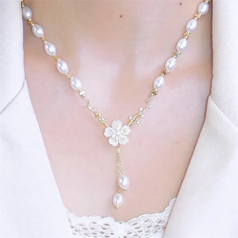 Alloy fashion necklace with pearl flower pendant featuring rose detailing in pearl flower colour