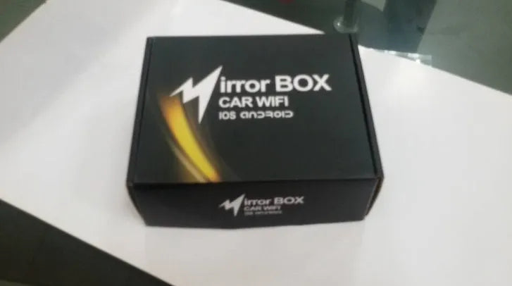 Black car mirror link box Wi-Fi converter with power cable, AV cable, and antenna for smartphone screen mirroring.