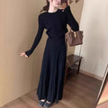 Dark grey knitted ethnic style dress suit with collage stitching, featuring a sweater and skirt.