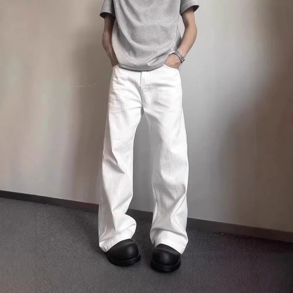 Men's white straight-leg cotton jeans with a mid-rise waist and zipper fly