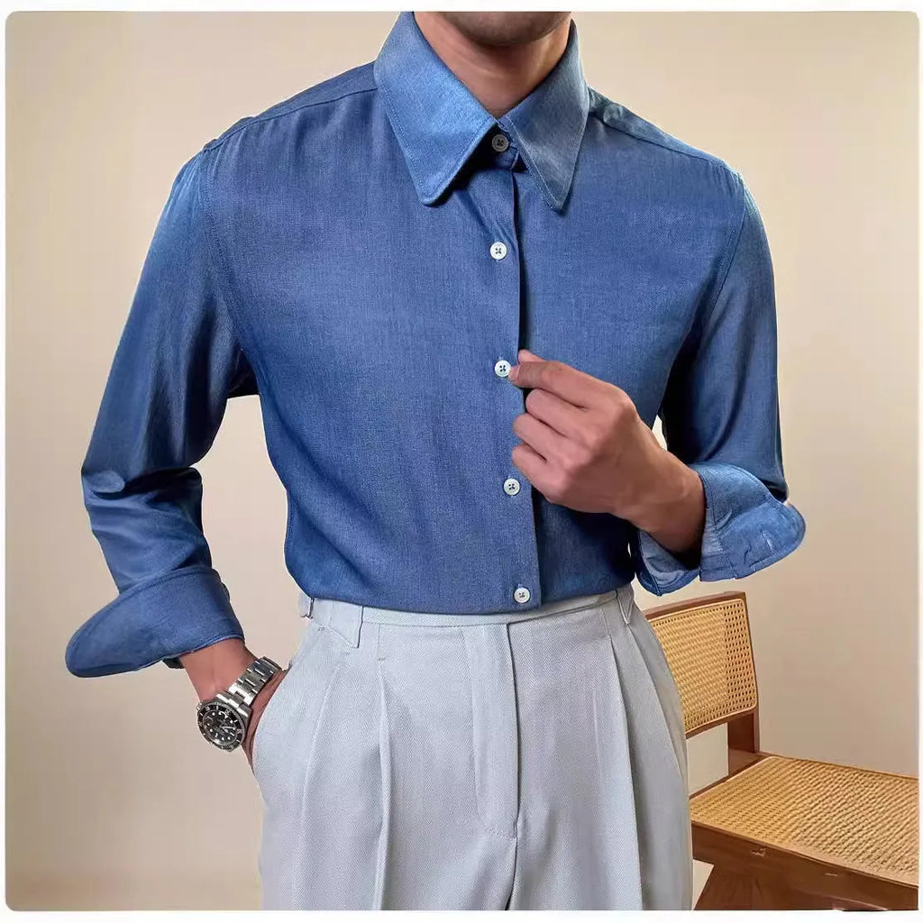 Man wearing a slim fit light blue long sleeve shirt with a round collar