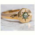 Gold coloured adjustable opening ring with star-shaped zircon design and oval profile