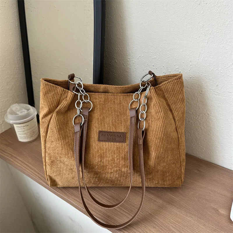 Corduroy one-shoulder tote handbag with three-dimensional pockets in black colour