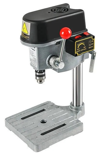 Bench drill and milling machine with cross bench pliers on workshop bench
