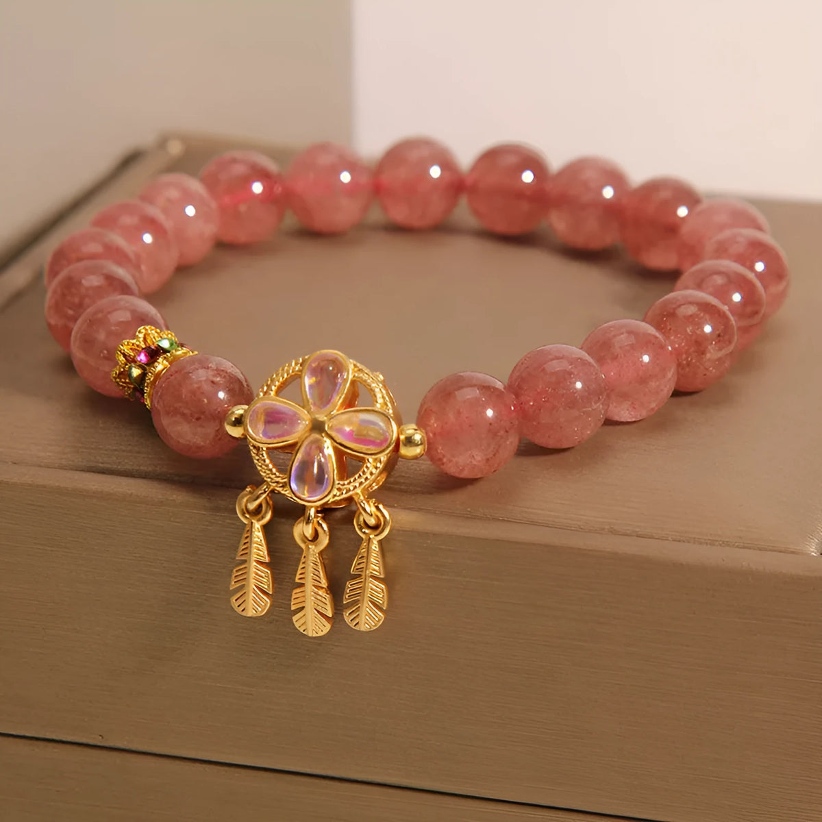 Women's strawberry quartz bracelet with four leaf clover dream catcher pendant charm