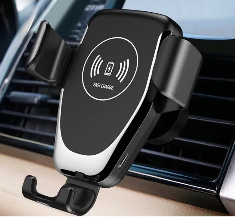 Black wireless car charger mounted on vehicle vent with iPhone automatically clamped in charging position