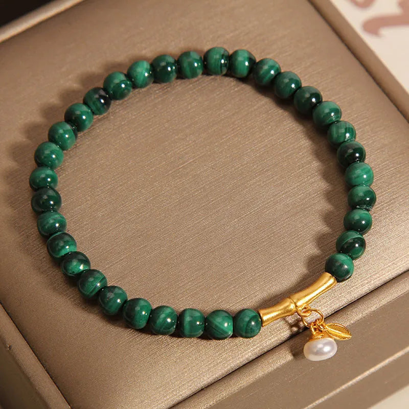 Women's white crystal bamboo bracelet showing adjustable design with bead arrangement