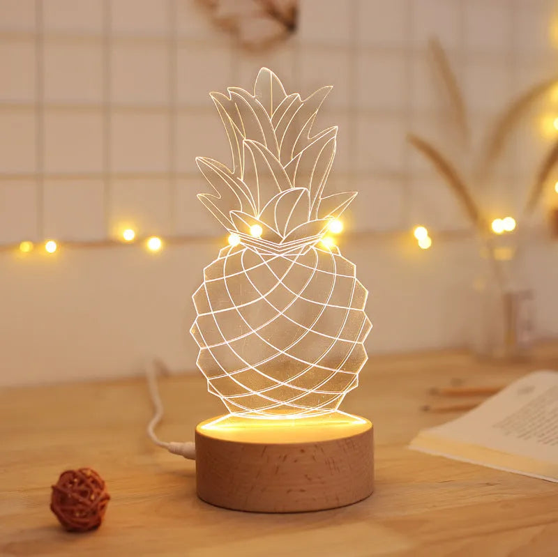 Wood and acrylic pineapple-shaped cartoon night light with USB cable and dimmer switch on a table.
